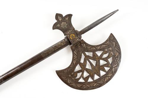 AN INDO-PERSIAN DECORATED WAR AXE WITH CONCEALED DAGGER