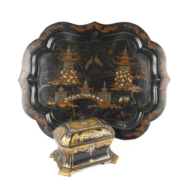 A VICTORIAN PARCEL-GILT DECORORATED PAPIER-MACHE TEA CADDY AND CARTOUCHE SHAPED TRAY (2)