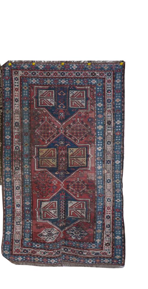 A COLLECTION OF TEXTILE FRAGMENTS AND ITEMS INCLUDING A WOOL RUG AND TWO SADDLE BAGS (10)