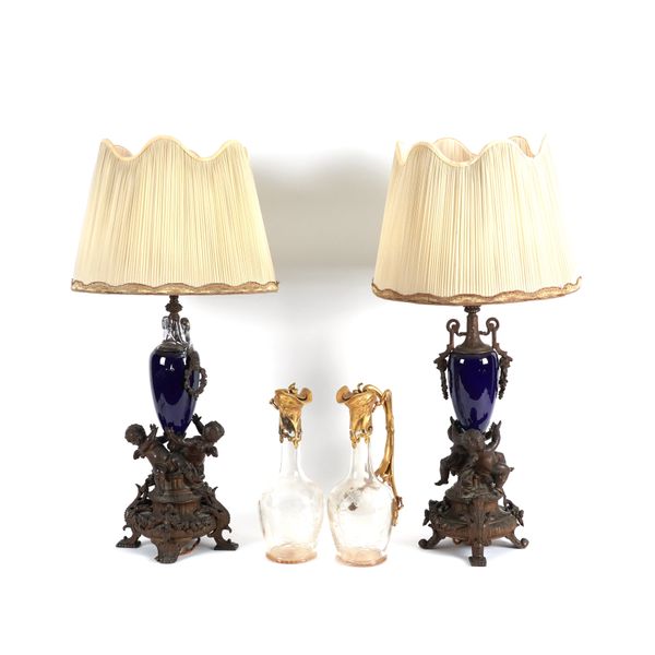 A PAIR OF BRONZE PATINATED SPELTER MOUNTED SEVRES BLUE CERAMIC TABLE LAMPS (4)