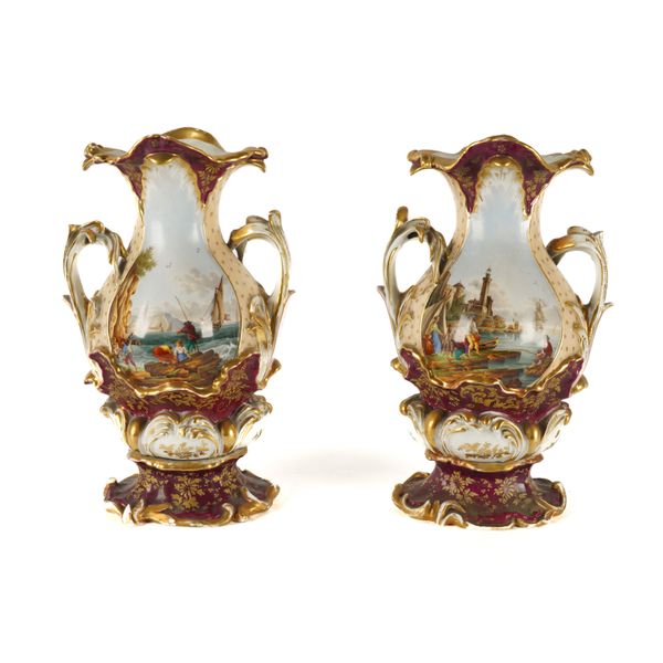 A PAIR OF CONTINENTAL PORCELAIN TWO HANDLED VASES (2)