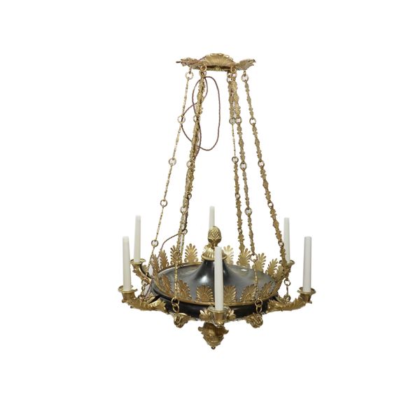 A REGENCY STYLE GILT AND PATINATED METAL SIX LIGHT CHANDELIER