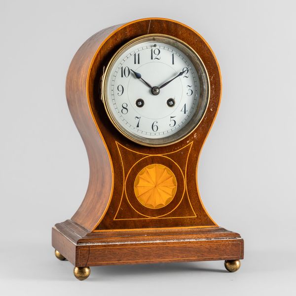 AN EDWARDIAN MAHOGANY, SATINWOOD AND BOXWOOD-OUTLINED BALLOON MANTEL CLOCK