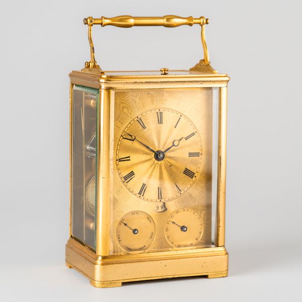 AN UNUSUAL EARLY FRENCH GILT METAL CALENDAR STRIKING CARRIAGE CLOCK WITH SKELETONISED LEVER  ESCAPEMENT