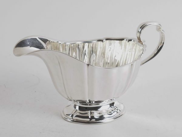 A LARGE SILVER SAUCEBOAT