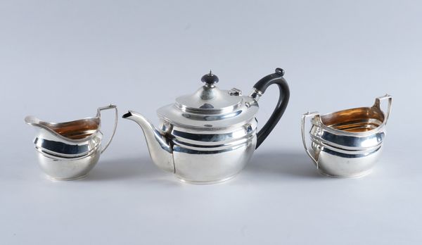 A SILVER THREE PIECE TEA SET