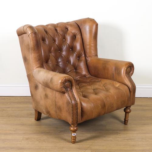 ALEXANDER AND JAMES; A 20TH CENTURY TAN LEATHER UPHOLSTERED WINGBACK EASY ARMCHAIR