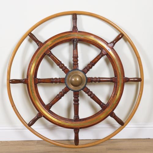 A TEAK AND BRASS MOUNTED SHIP'S WHEEL