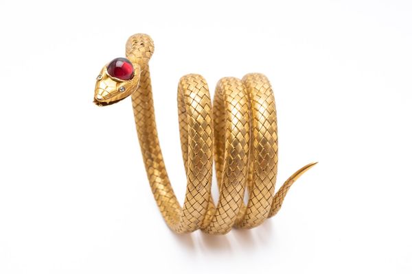 A VICTORIAN GOLD, DIAMOND AND GARNET SNAKE BRACELET