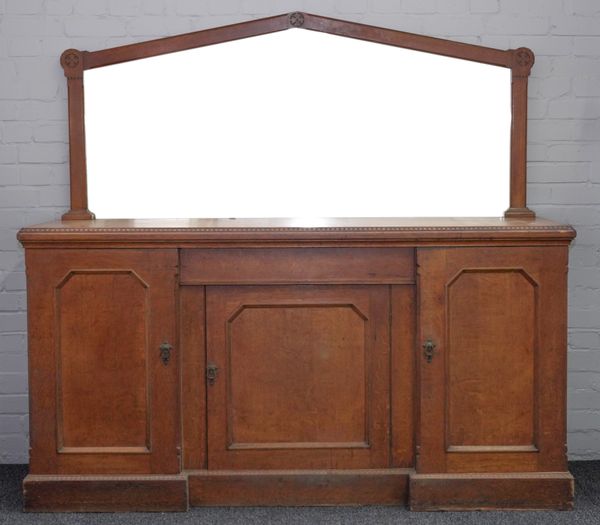 A LATE VICTORIAN OAK GOTHIC REVIVAL MIRRORED BACK SIDEBOARD