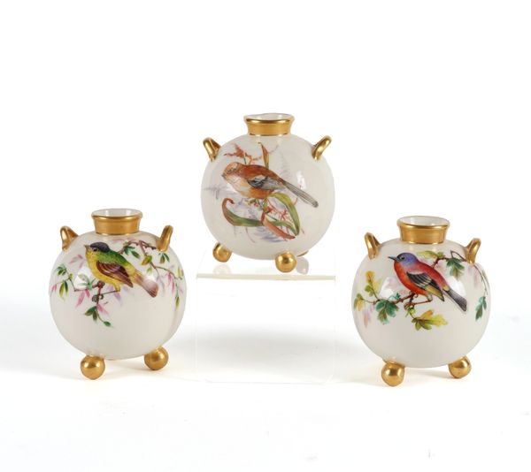 A PAIR OF ROYAL WORCESTER TWO-HANDLED GLOBULAR VASES (3)