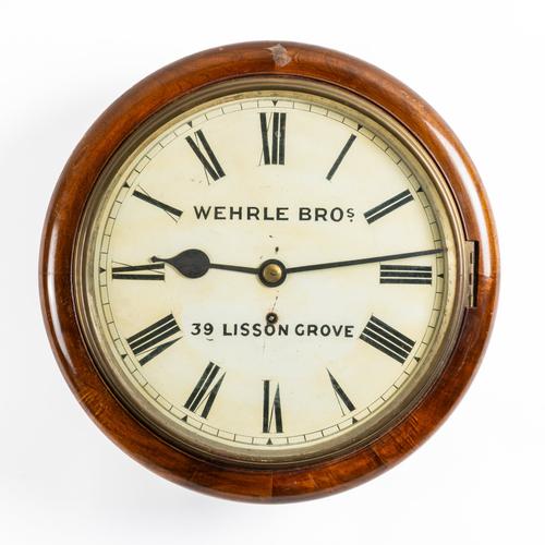 A LARGE MAHOGANY DIAL CLOCK
