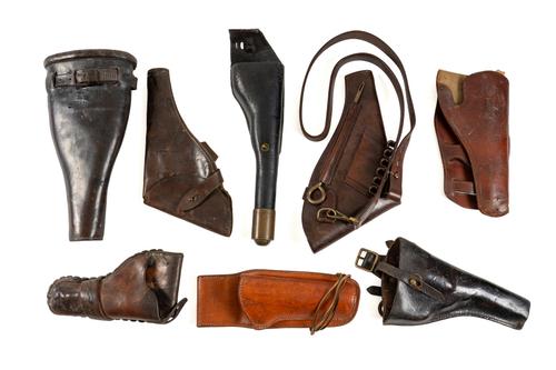 A GROUP OF EIGHT MILITARY AND CIVILIAN LEATHER HOLSTERS (8)