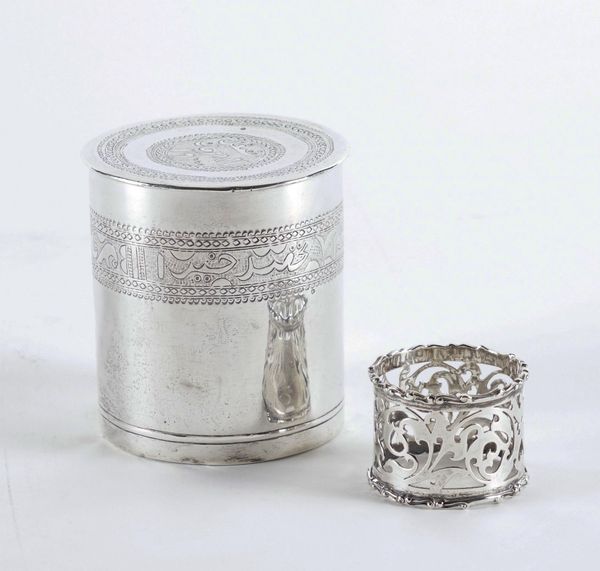 AN ASIAN SILVER CYLINDRICAL BOX AND COVER AND A SILVER NAPKIN RING (2)