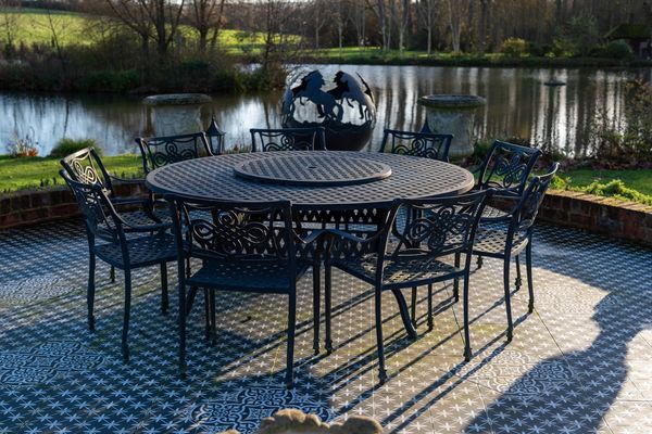 A BLACK PAINTED CAST ALUMINIUM CIRCULAR GARDEN TABLE (9)