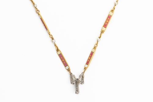 AN EARLY 20TH CENTURY DIAMOND AND ENAMEL CHAIN
