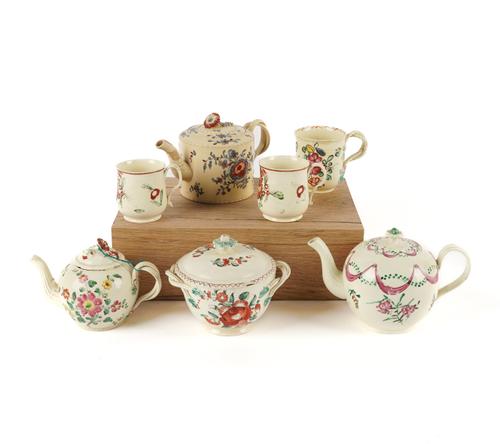 A GROUP OF FLOWER PAINTED CREAMWARE (11)
