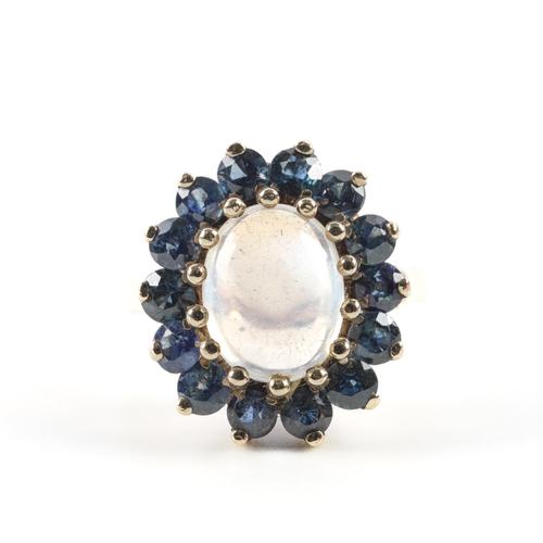 A 9CT GOLD, MOONSTONE AND SAPPHIRE CLUSTER RING