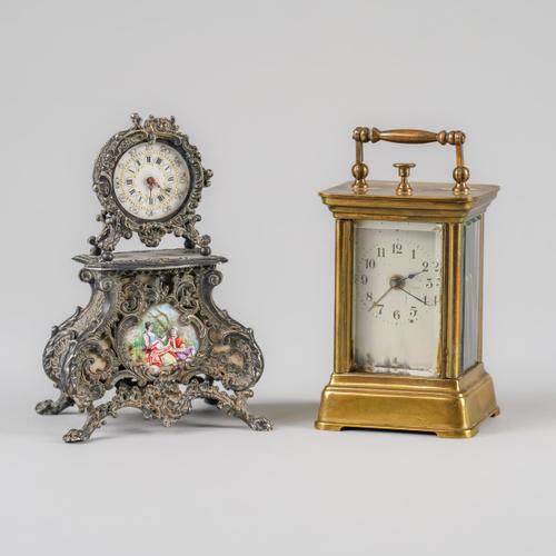 A VIENNESE STYLE ENAMEL AND SILVERED METAL MINIATURE TIMEPIECE AND A BRASS CARRIAGE ALARM TIMEPIECE (2)