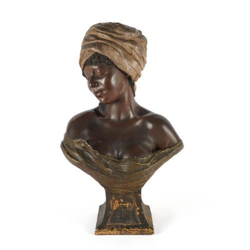 GOLDSCHEIDER, VIENNA: AN AUSTRIAN POLYCHROME TERRACOTTA BUST OF A NUBIAN GIRL