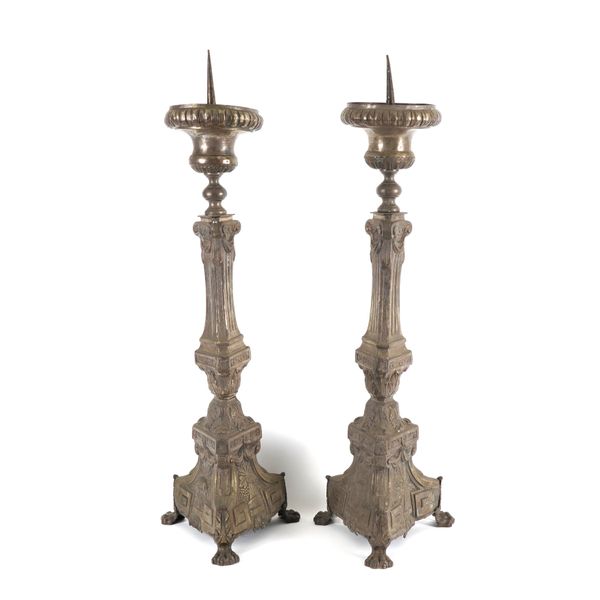 A PAIR OF CONTINENTAL SILVERED METAL PRICKET ALTAR CANDLESTICKS (2)