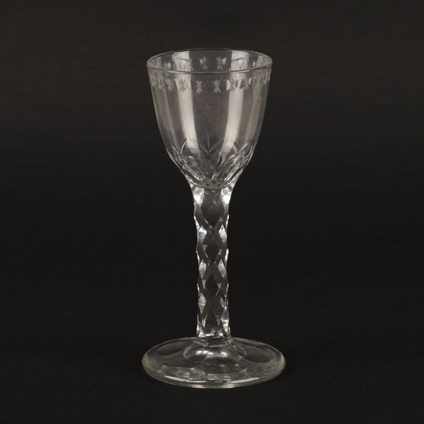 A FACET STEMMED WINE GLASS