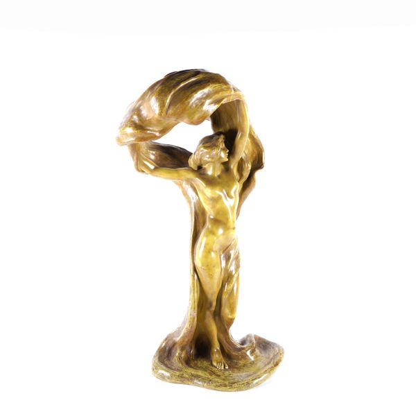 A CONTINTENTAL ART NOUVEAU STYLE PLASTER FIGURE OF A DANCER