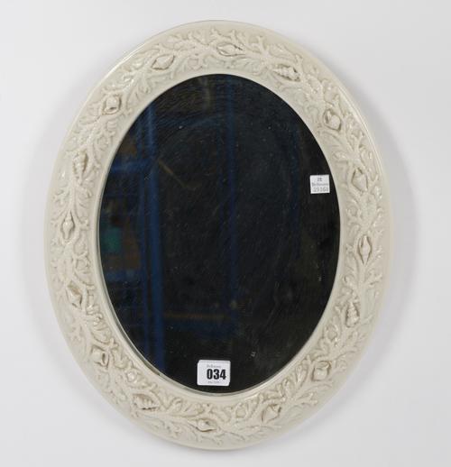 A BELLEEK PORCELAIN OVAL MIRROR
