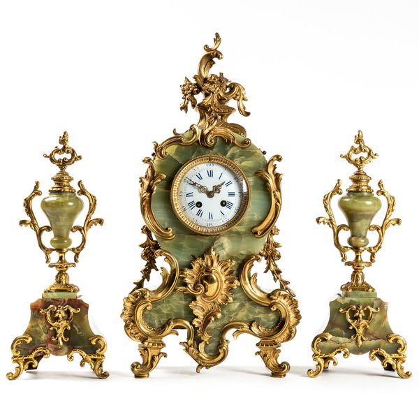 A GILT METAL MOUNTED ONYX CLOCK GARNITURE (3)