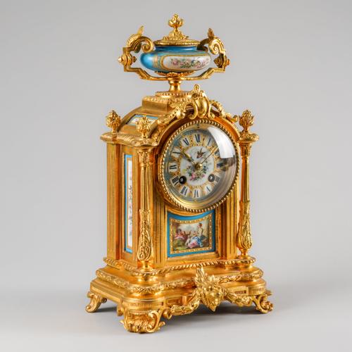 A FRENCH ORMOLU AND SEVRES-STYLE PORCELAIN-MOUNTED MANTEL CLOCK