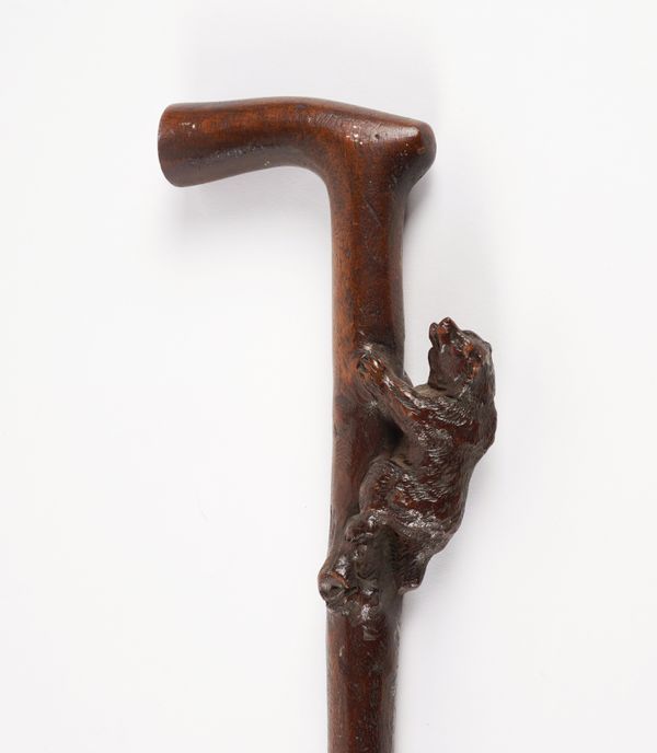 A BLACK FOREST CARVED BEAR WALKING CANE