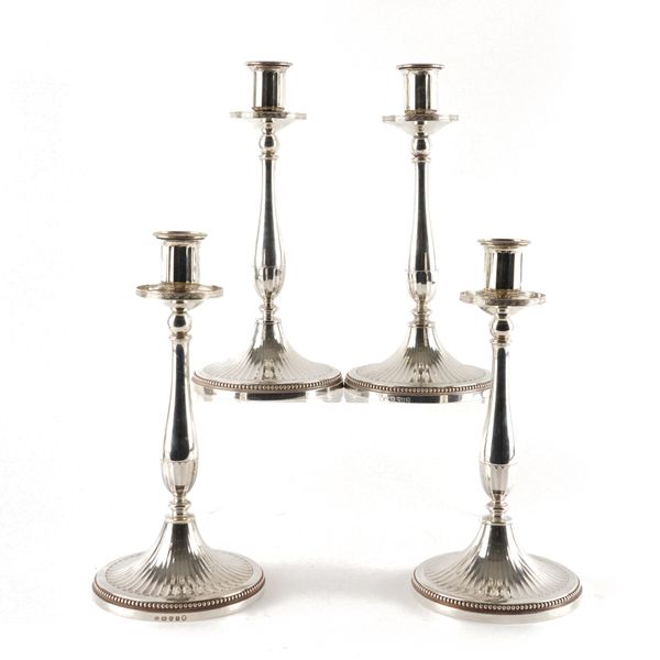 A SET OF FOUR GEORGE III SILVER TABLE CANDLESTICKS (4)