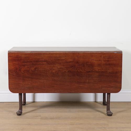 A GEORGE II MAHOGANY DROP FLAP DINING TABLE