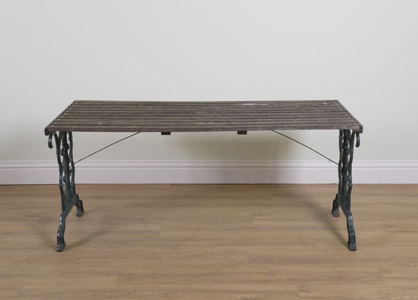 A HARDWOOD SLATTED RECTANGULAR GARDEN TABLE ON GREEN PAINTED METAL TRESTLE SUPPORTS