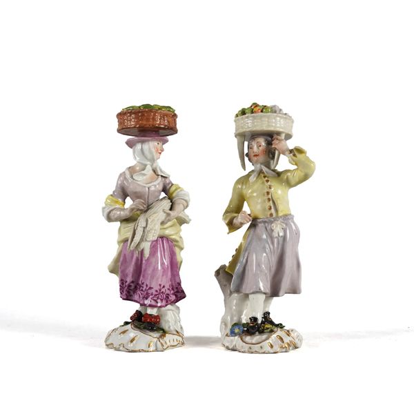 TWO RARE MEISSEN FIGURES OF A VEGETABLE AND FRUIT SELLER FROM THE `CRYES OF LONDON'