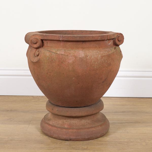 COMPTON POTTERY; A TERRACOTTA SCROLL GARDEN URN ON STAND (2)
