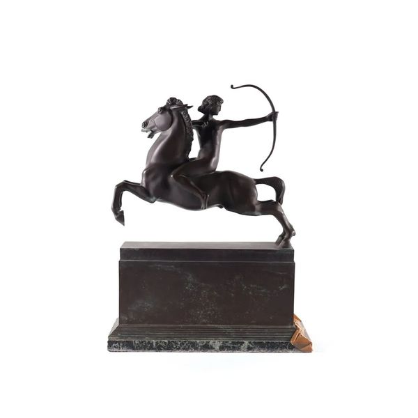 AN ART DECO PATINATED BRONZE SCULPTURE OF DIANA THE HUNTRESS