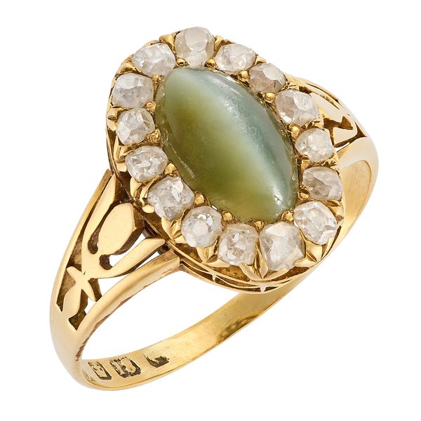 A CAT'S EYE CHRYSOBERYL AND DIAMOND CLUSTER RING