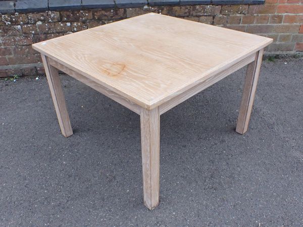 A LIMED OAK COFFEE TABLE, IN THE STYLE OF HEAL'S