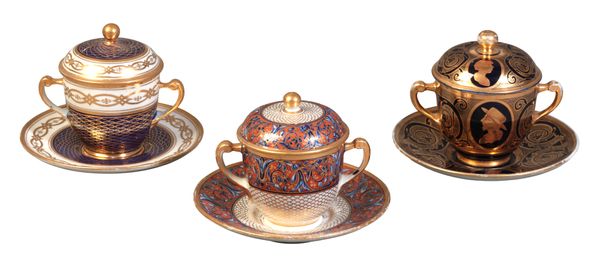 A GROUP OF THREE PORCELAIN CHOCOLATE CUPS, COVERS AND STANDS