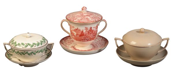 A GROUP OF THREE WEDGWOOD TWO-HANDLED CUPS, COVERS AND STANDS