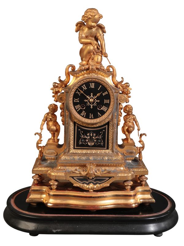 A FRENCH GILT METAL MANTEL CLOCK