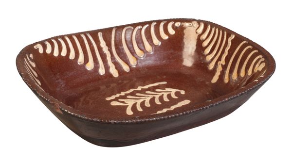 AN ENGLISH TERRACOTTA SLIPWARE DISH