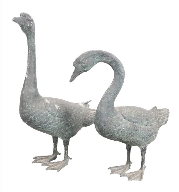 A NEAR PAIR OF PATINATED METAL GEESE