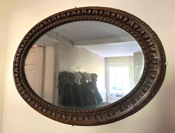 A VICTORIAN OAK MIRROR