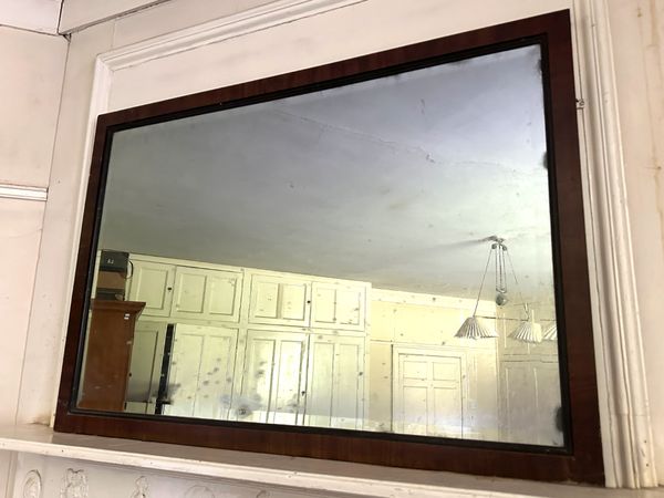 A MAHOGANY OVERMANTEL MIRROR
