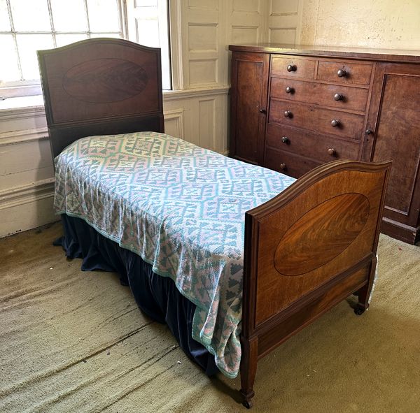 AN EDWARDIAN MAHOGANY SINGLE BED