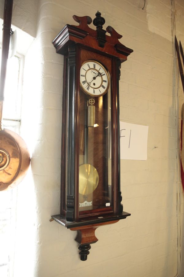 A VIENNA WALNUT CASED WALL CLOCK