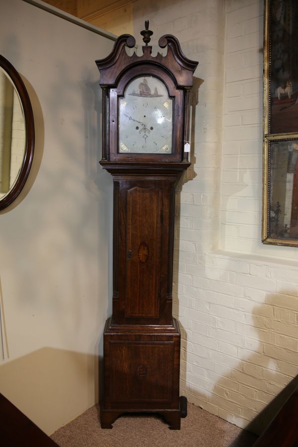 AN EARLY 19TH CENTURY MAHOGANY AND OAK LONGCASE CLOCK