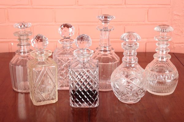 THREE EDWARDIAN CUT GLASS DECANTERS